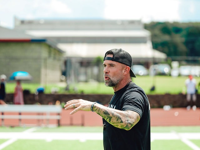 Andy McCloy, Founder of BCI Performance & Fitness, directing athletes from the sideline