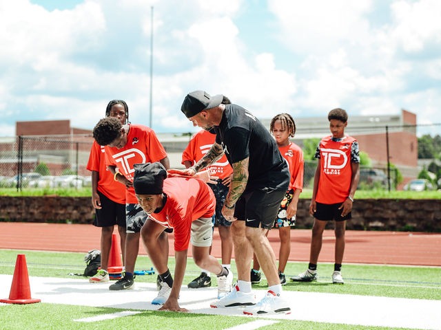 Andy McCloy, Founder of BCI Performance & Fitness, coaching young athletes on stance and start technique